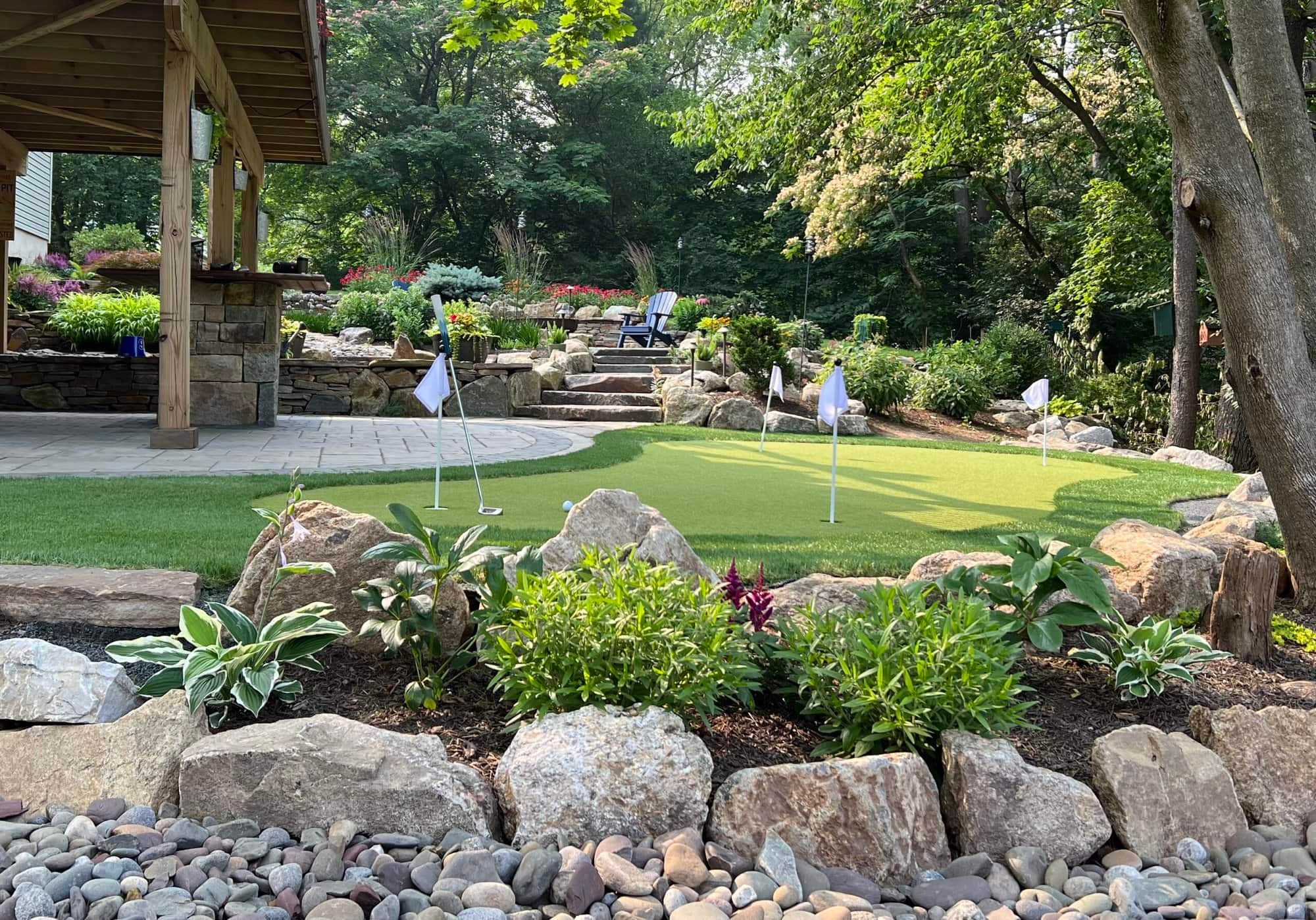 Beautifully landscaped backyard putting green